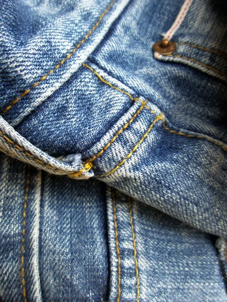 Jeans vintage con costuras de fondo — Foto de Stock