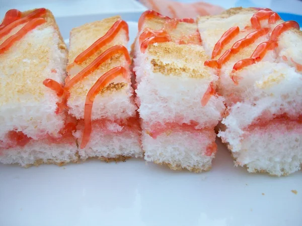 Toast topped with strawberry jam — Stock Photo, Image