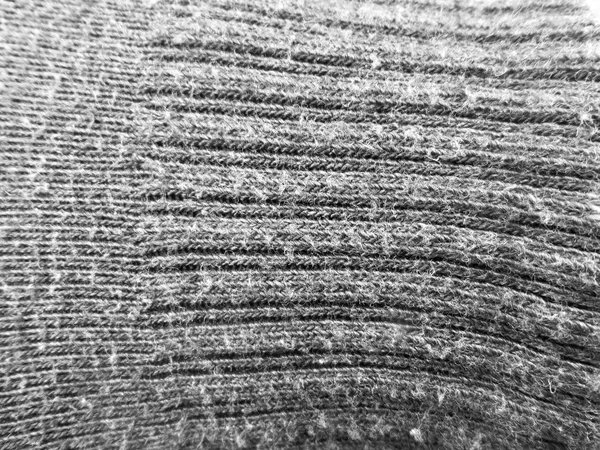 Šedá pletená textilie — Stock fotografie