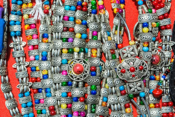 Colorful decorative stone with silver bracelet — Stock Photo, Image