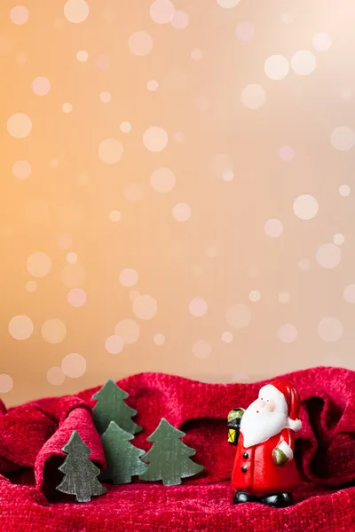 Christmas ornament: Santa Claus toy and little trees — Stock Photo, Image