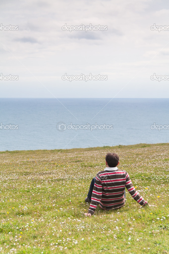 Caucasian man in an ox-eye daisy meadow