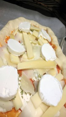 Bake homemade pizza hot from oven.