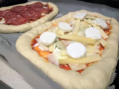 Bake homemade pizza hot from oven.