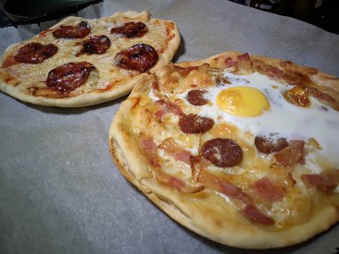 Bake homemade pizza hot from oven.