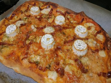 Bake homemade pizza hot from oven.