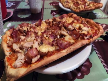 Bake homemade pizza hot from oven.