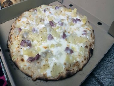 Bake homemade pizza hot from oven.