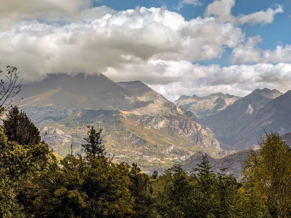 Landscape with green mountains and traditional towns