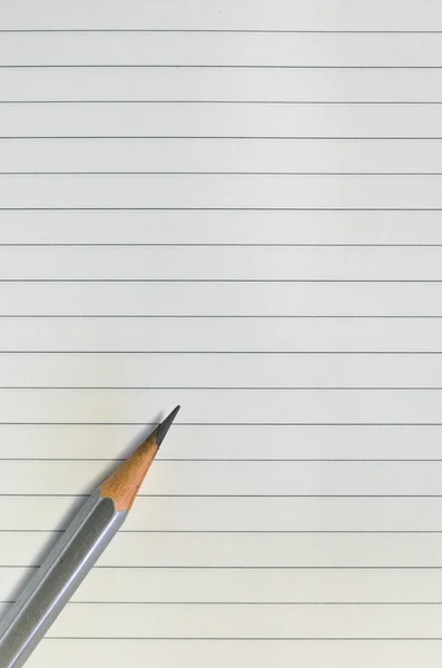 Pencil on lined paper — Stock Photo, Image
