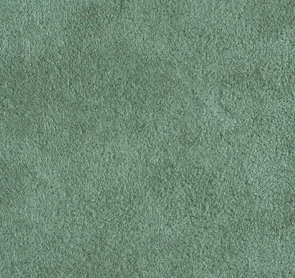 Velvet texture mint green color crumpled fabric background