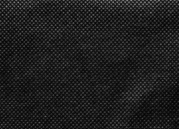 不織布又はスパンボンド生地の黒の質感の背景 — ストック写真