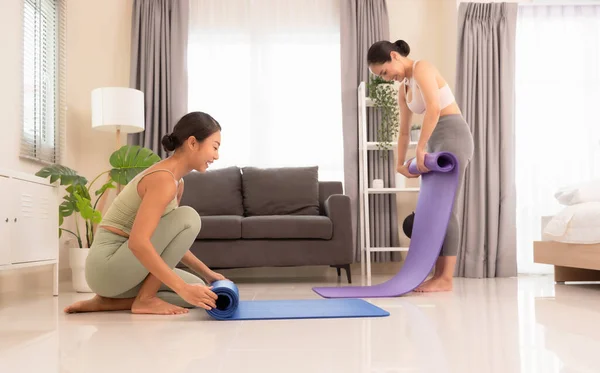 Two Happiness Young Yoga Women Rolling Mat Doing Yoga Exercise — Stock Photo, Image