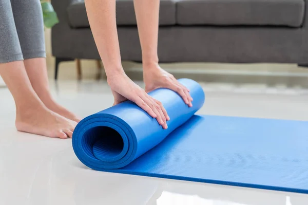 Cropped Image Woman Rolling Blue Mat Doing Yoga Exercise Workout — Stock Photo, Image