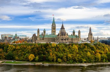 Stunning autumn view of Parliament Hill across the Ottawa River in Ottawa, Canada clipart