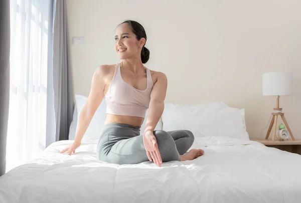 Asian Woman Doing Yoga Stretching Exercise Bed Home Morning Workout — Stock Photo, Image