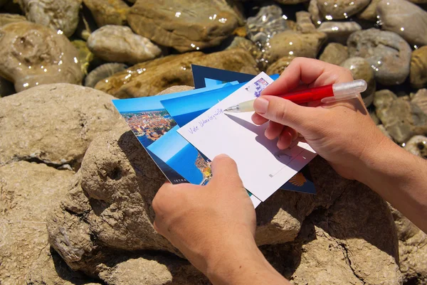 Ansichtskarte schreiben - scrittura di una cartolina fotografica 01 — Foto Stock