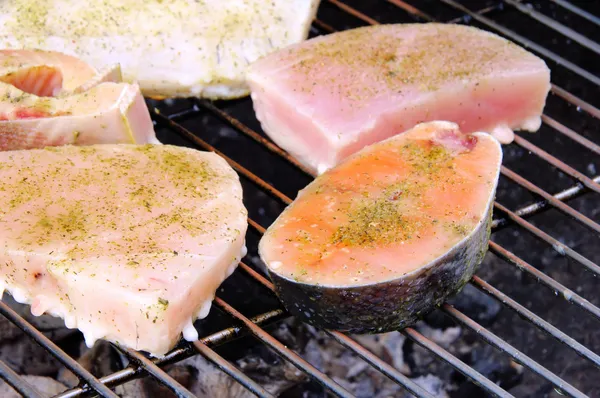 Grilling steak from fish — Stock Photo, Image