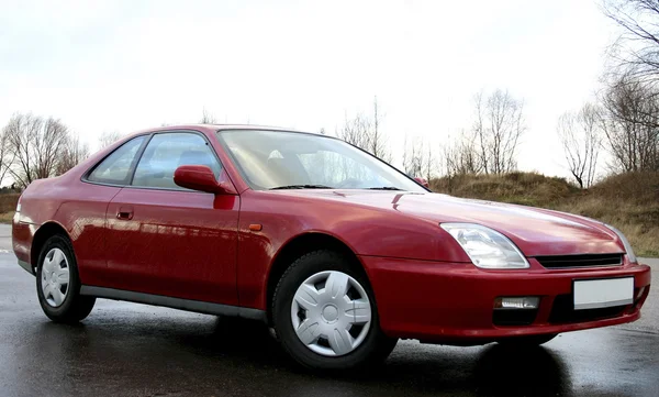 Coche rojo de 3d Fotos de stock libres de derechos