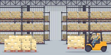 Industrial warehouse for the storage products and racks with stacked boxes. Worker driving forklift loading pallets. Industrial storage and distribution of products