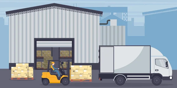 Industrial warehouse for the storage of products. Worker driving forklift loading pallets to refrigerator truck. Industrial storage and distribution of products