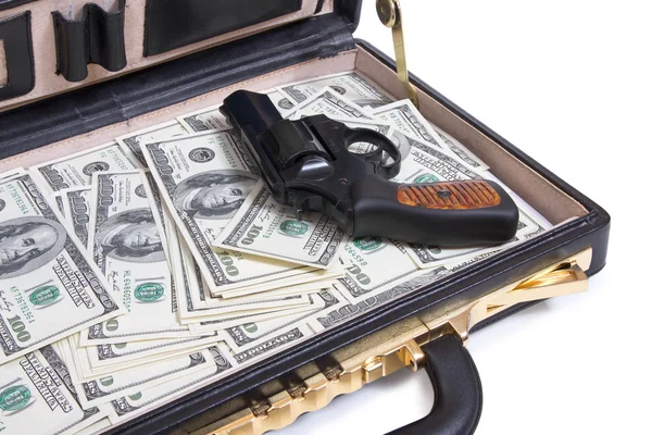 Geval met geld en pistool — Stockfoto