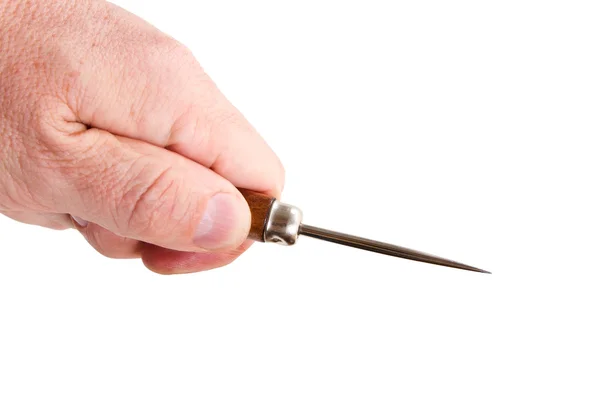 Hand with a sharp pricker — Stock Photo, Image