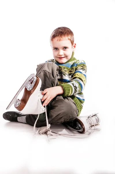 Boy with skates, insulated background — Stock Photo, Image