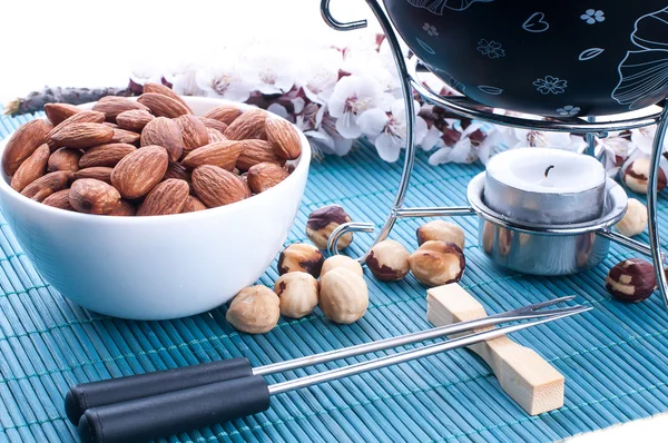 Chocolate fondue with nuts — Stock Photo, Image