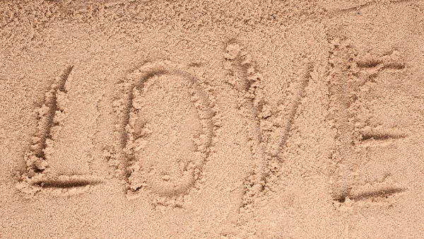 Love message written in sand Stock Image