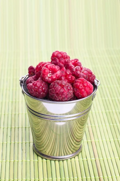 Beautiful raspberries in bucket — Stock Photo, Image