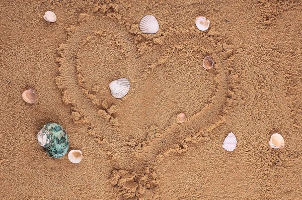 Heart drawing in the sand on the beach — Stock Photo, Image