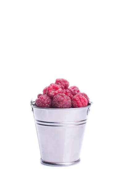 Beautiful raspberries in bucket isolated on white — Stock Photo, Image