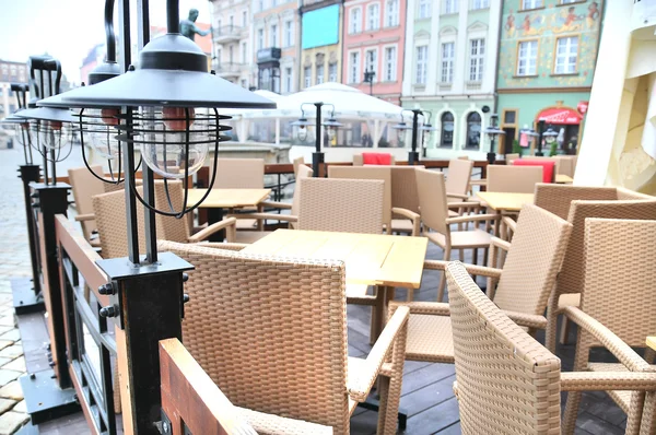 Street view of a empty coffee terrace with tables and chairs in old town of Antalya, Turkey