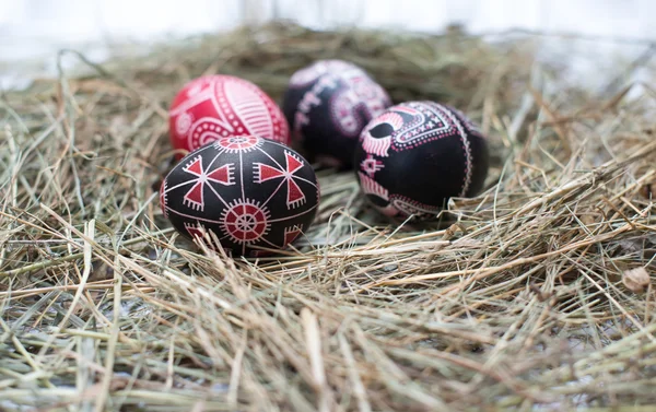 Colorful Easter eggs in a little basket. Easter background, spring themes — Stock Photo, Image