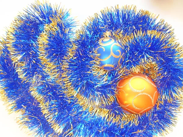 Christmas and New Year balls blue and gold tinsel abstract background — Stock Photo, Image