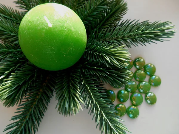 Christmas decoration firtree and green candle — Stock Photo, Image