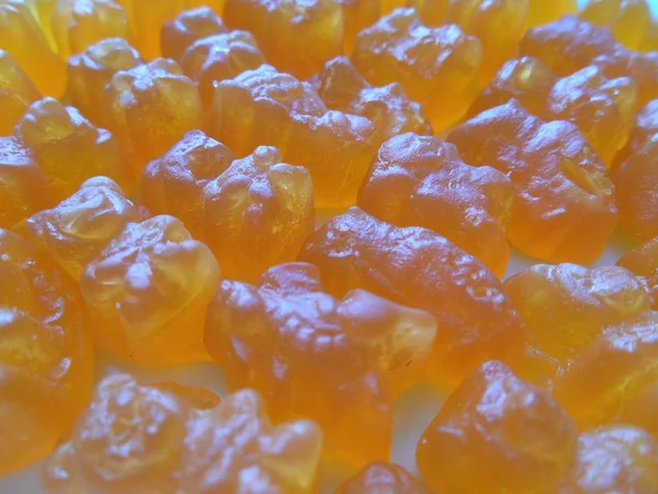 歯ごたえのキャンディ オレンジ背景 — ストック写真