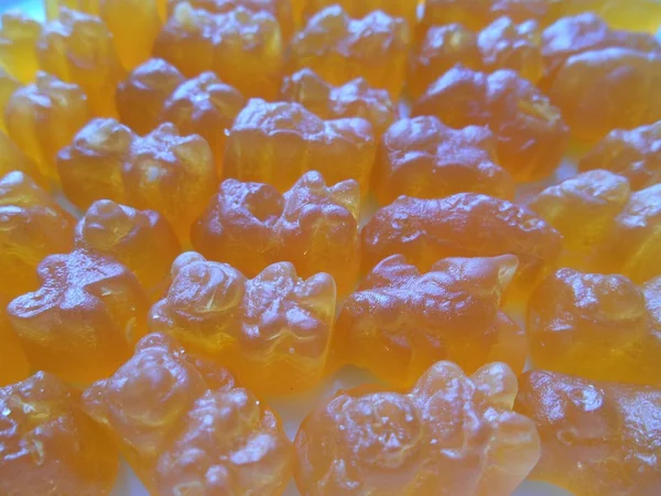 Doces mastigáveis fundo laranja — Fotografia de Stock