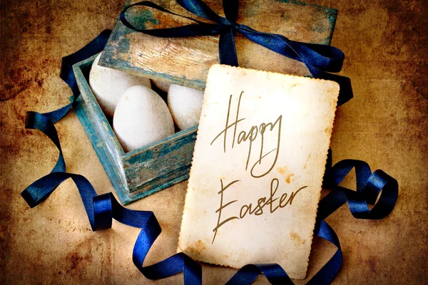 Vintage card with box with easter eggs — Stock Photo, Image