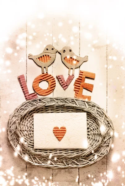 Vintage holidays card with a two birds and heart as a symbol of love