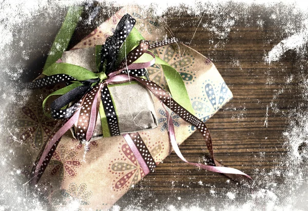 Vintage holidays gifts with packaging paper and atlas bows