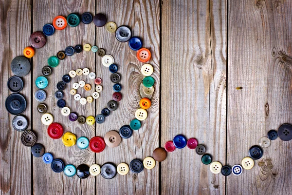 Set of vintage buttons on old wooden table — Stock Photo, Image