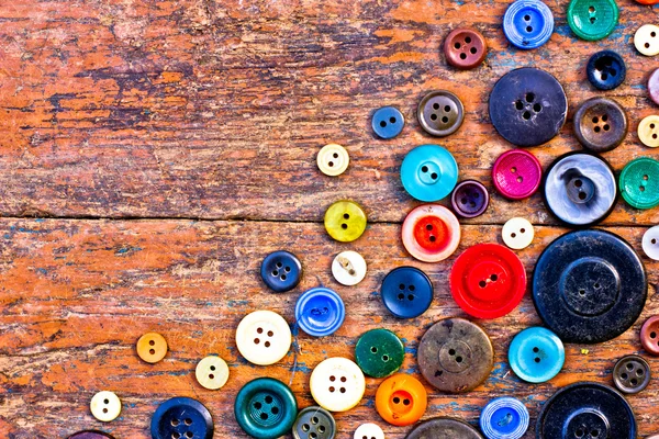 Set of vintage buttons on old wooden table — Stock Photo, Image