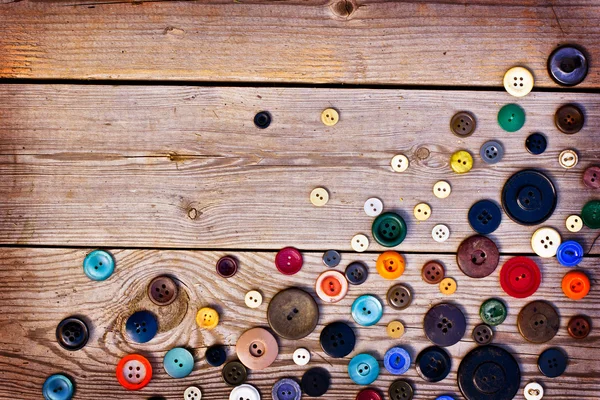 Set of vintage buttons on old wooden table — Stock Image Set of vintage buttons on old wooden table Royalty Free Stock Images
