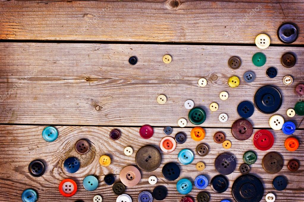 Set of vintage buttons on old wooden table — Stock Photo © avgustin