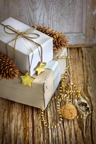 White gift boxes and christmas decorations — Stock Photo, Image