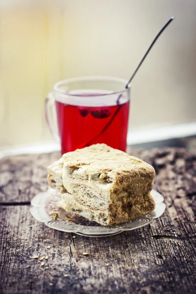 Cake with cup of hot fruite tea — Stock Photo, Image