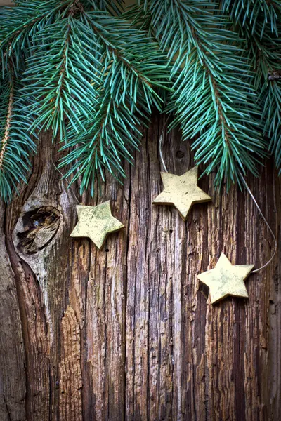 Christmas pine branches and stars — Stock Photo, Image