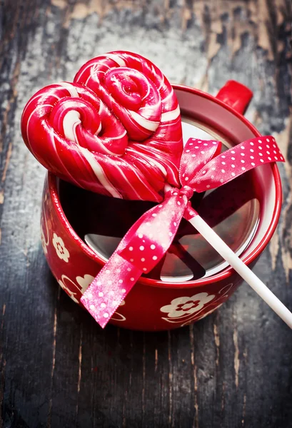 Lollipop and cup — Stock Photo, Image